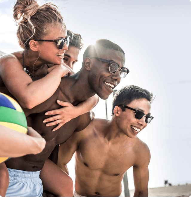Group of Friends hairless and happy on the beach after getting LightSheer&reg; QUATTRO&trade; laser